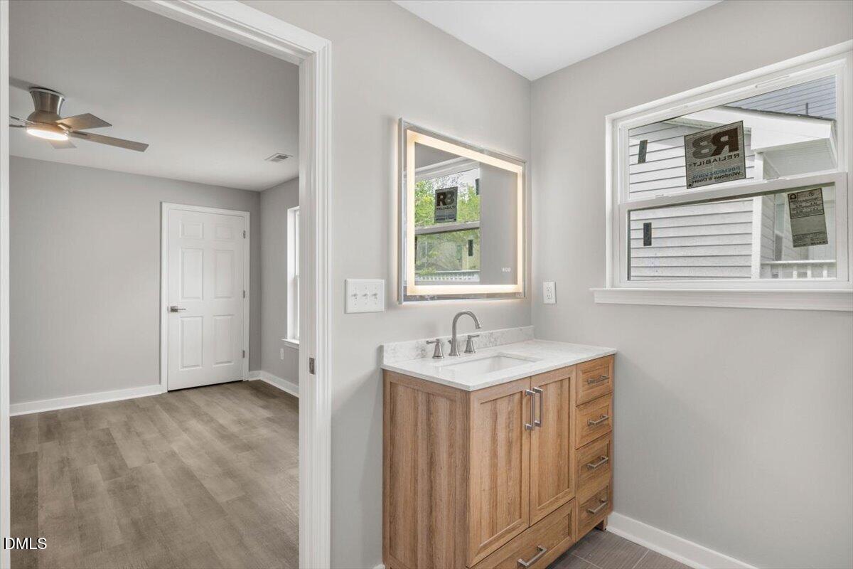 509 Sparella Street Durham, NC 27703 - Photo 24 of 30 a bathroom with a sink a vanity and a mirror