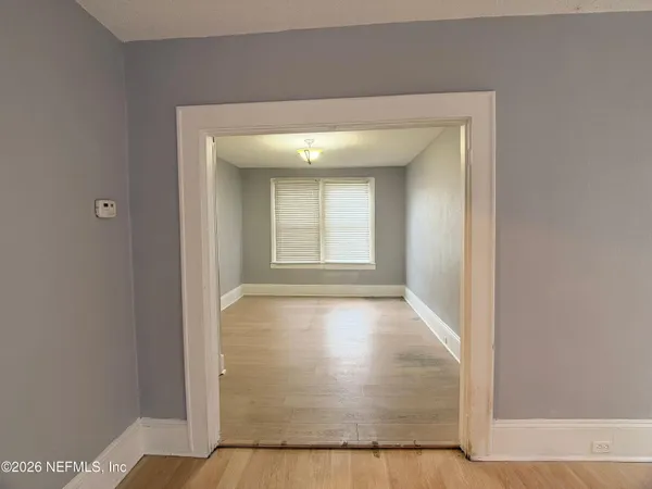 view of an empty room with window