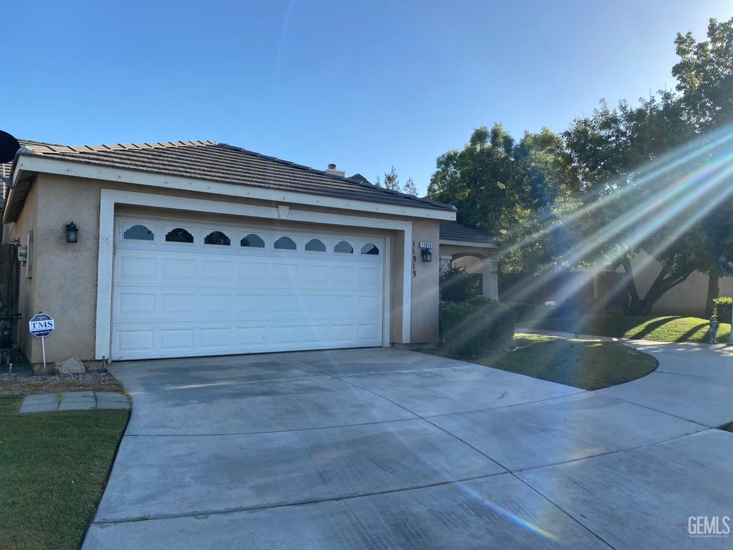 Undisclosed Address Bakersfield, CA 93311 - Photo 3 of 4 a front view of a house with a garage