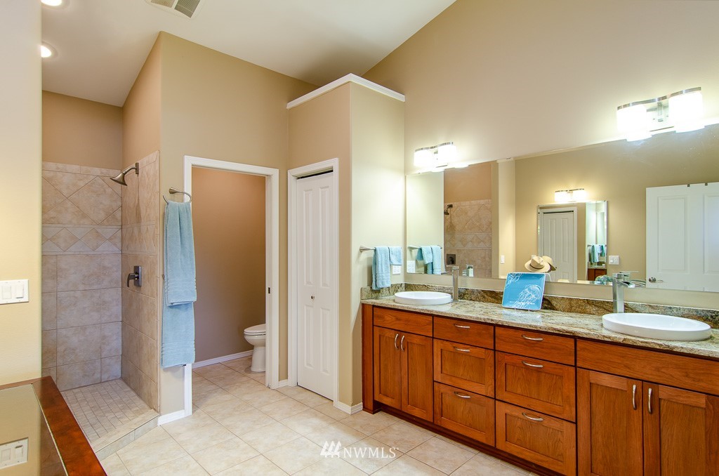 15 South Bank Road Elma, WA 98541 - Photo 12 of 32 a bathroom with a double vanity sink mirror and double
