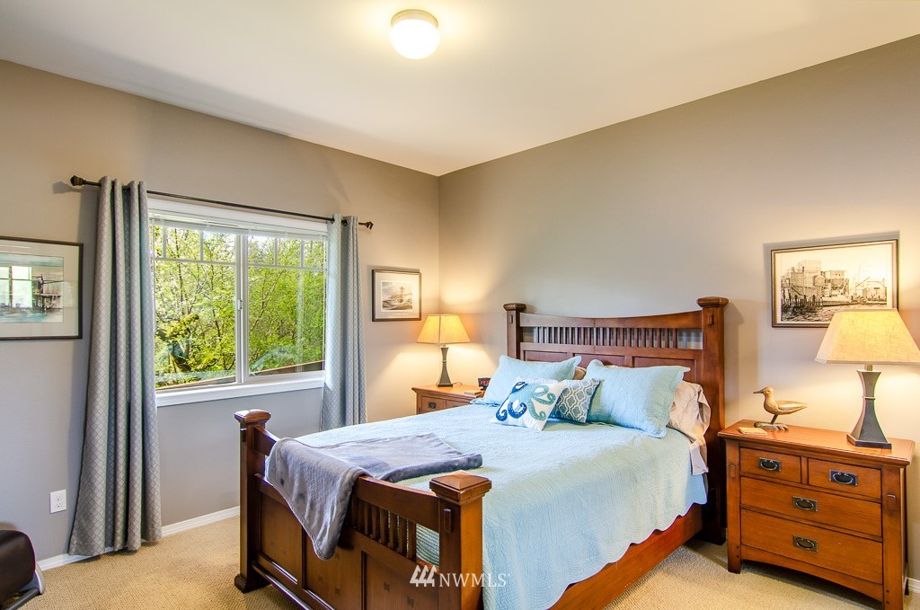 15 South Bank Road Elma, WA 98541 - Photo 14 of 32 a bedroom with a bed and a window