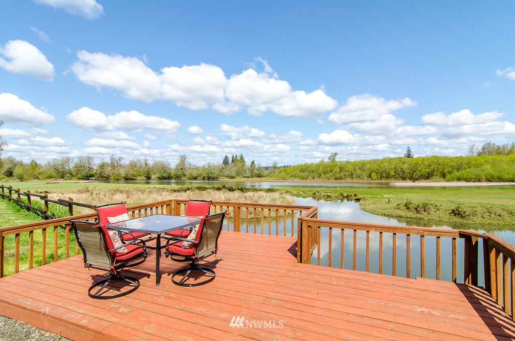 15 South Bank Road Elma, WA 98541 - Photo 20 of 32 a view of a lake with furniture