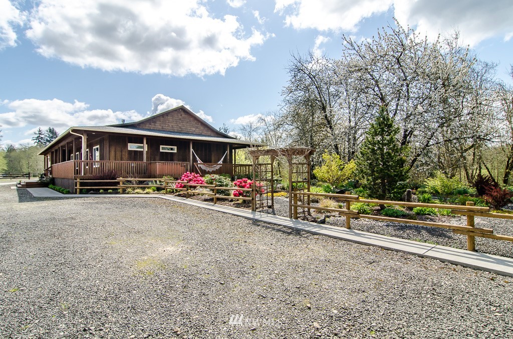 15 South Bank Road Elma, WA 98541 - Photo 21 of 32 a view of a house with large space and a car park front of it