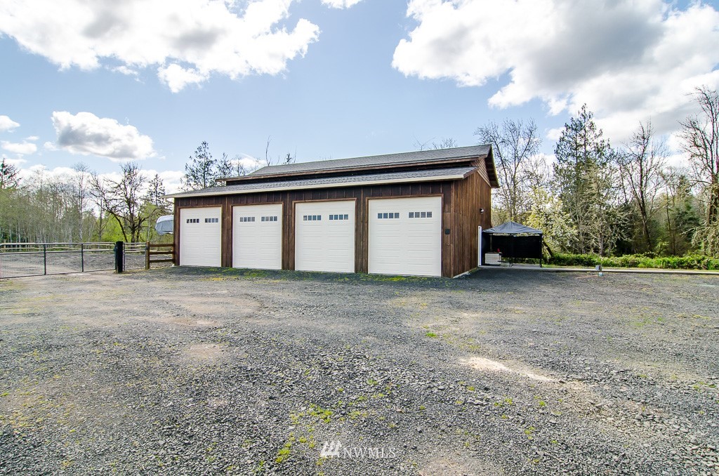 15 South Bank Road Elma, WA 98541 - Photo 24 of 32 a view of a house with a backyard