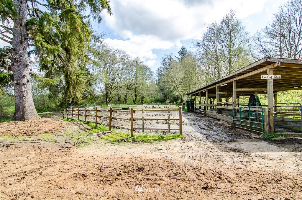 15 South Bank Road Elma, WA 98541 - Photo 25 of 32 a view of a wooden deck with a trees