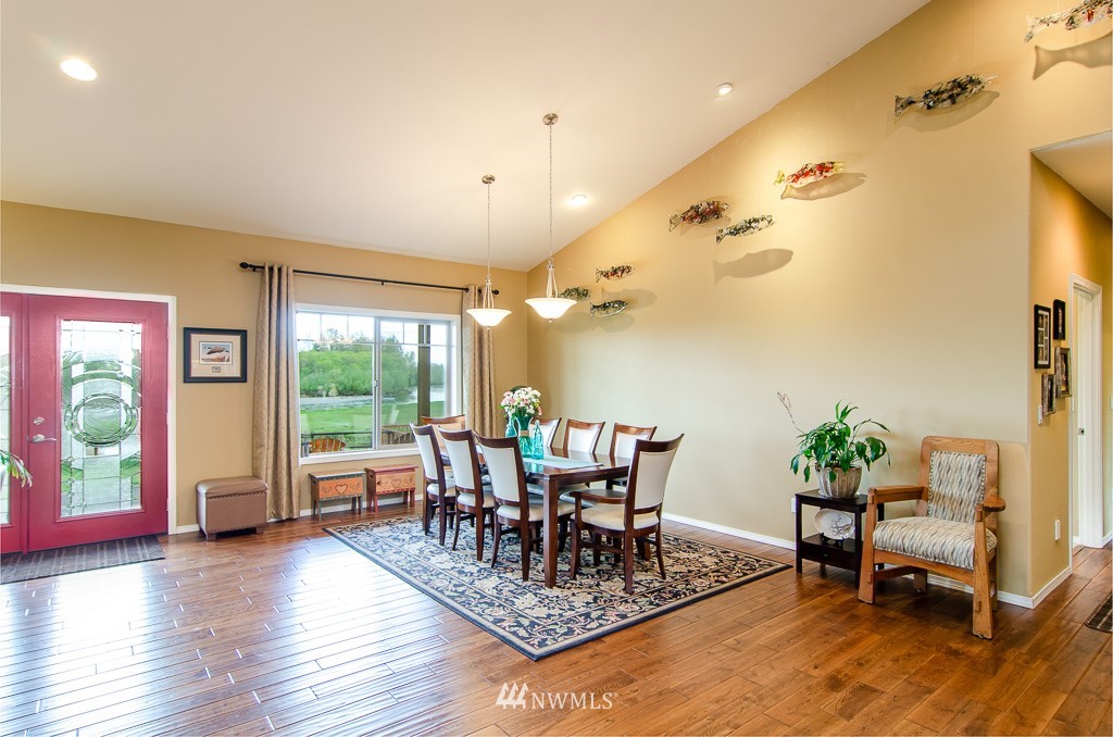 15 South Bank Road Elma, WA 98541 - Photo 8 of 32 a dining room with furniture window and wooden floor