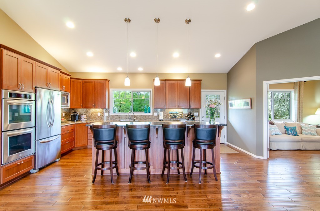 15 South Bank Road Elma, WA 98541 - Photo 9 of 32 a view of a dining room with furniture window and wooden floor