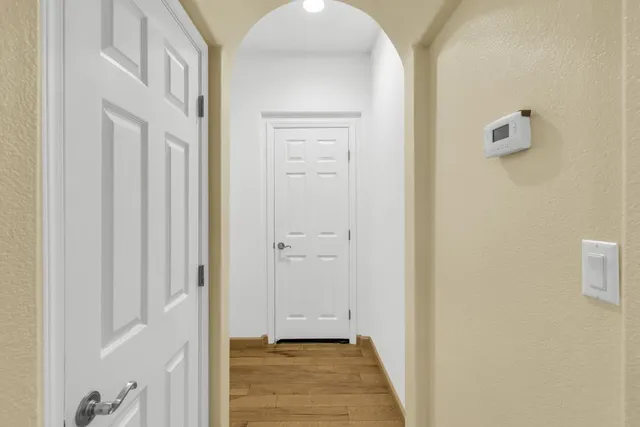 a kitchen with granite countertop a stove and cabinets