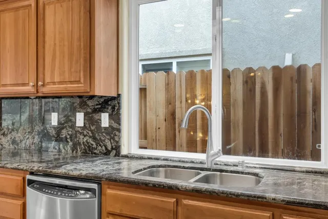 a living room with furniture flat screen tv and a fireplace