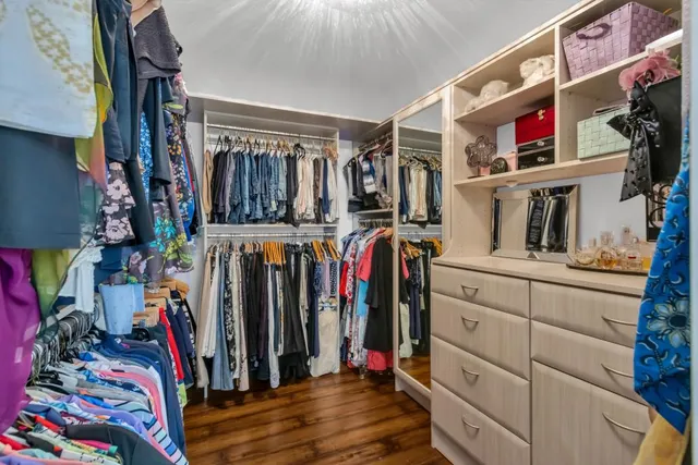 a view of a sitting area with trees in front of it