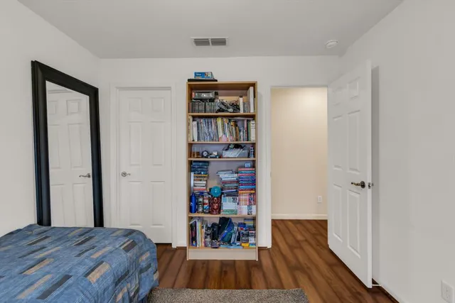 an aerial view of residential houses with outdoor space and street view