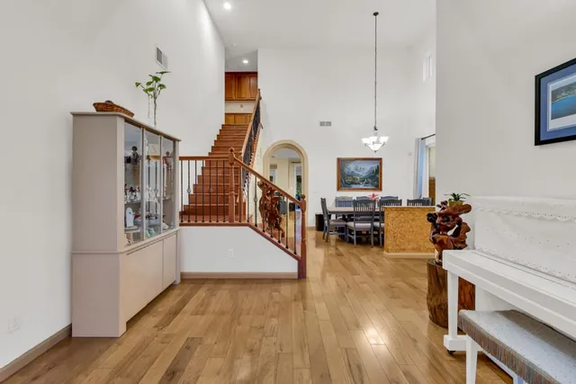 a dining room with furniture a livingroom and chandelier