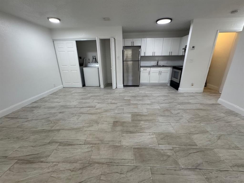 481 Banks Road, Unit 1 Margate, FL 33063 - Photo 3 of 13 a view of a refrigerator in kitchen and a window