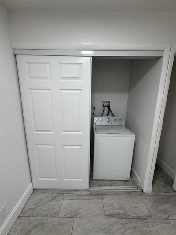 481 Banks Road, Unit 1 Margate, FL 33063 - Photo 6 of 13 a utility room with cabinets washer and dryer