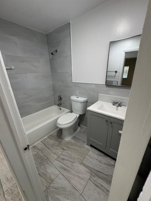 481 Banks Road, Unit 1 Margate, FL 33063 - Photo 8 of 13 a bathroom with a sink a toilet and shower