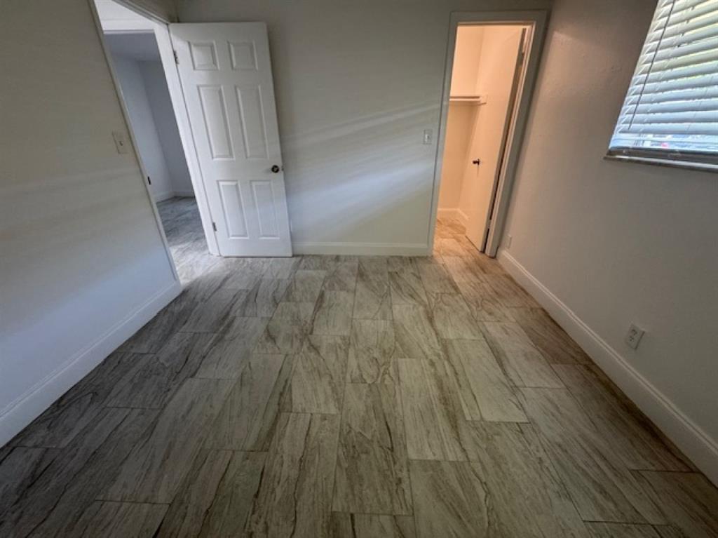 481 Banks Road, Unit 1 Margate, FL 33063 - Photo 10 of 13 an entryway view with wooden floor and staircase