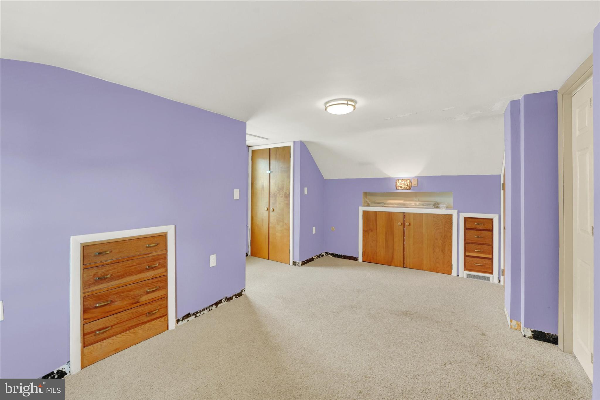 809 Van Reed Road Wyomissing, PA 19610 - Photo 17 of 25 Charming attic space with vibrant purple walls.