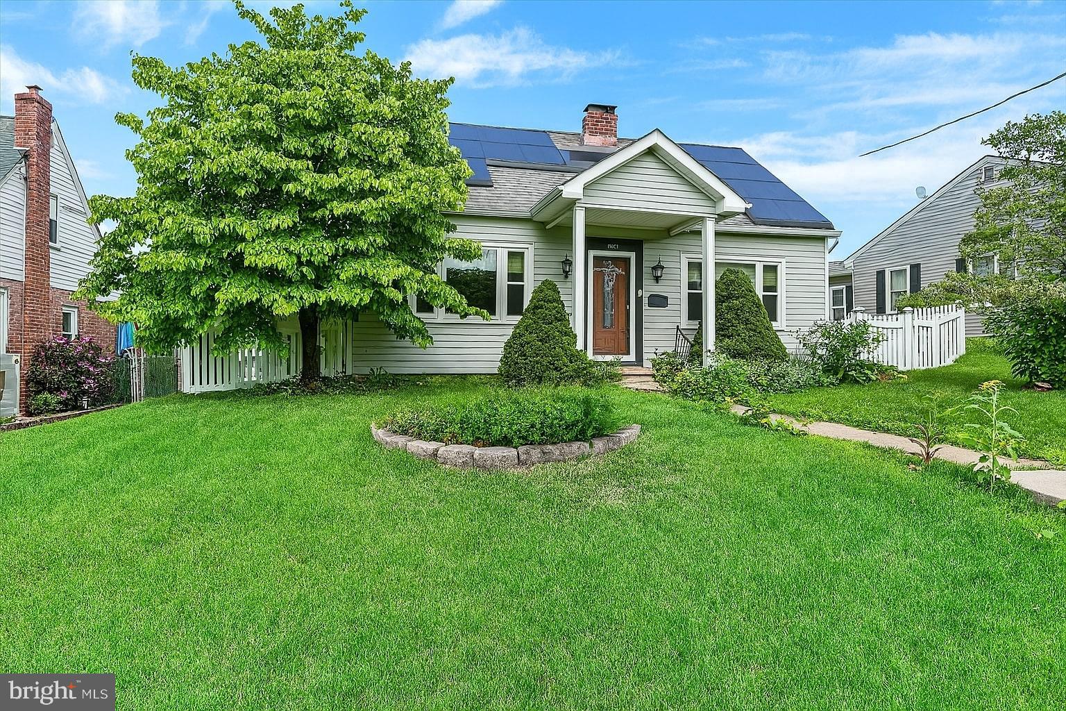 809 Van Reed Road Wyomissing, PA 19610 - Photo 2 of 25 Charming home with lush green landscaping.