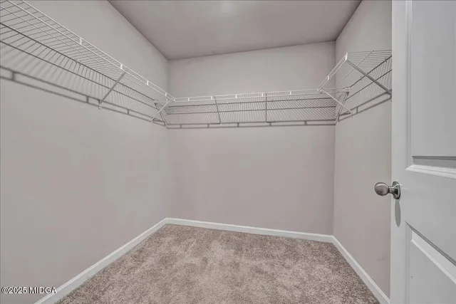 a bathroom with a granite countertop toilet sink and shower