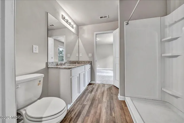 a view of a house with a yard and garage