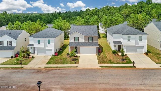 a front view of a house with a garage