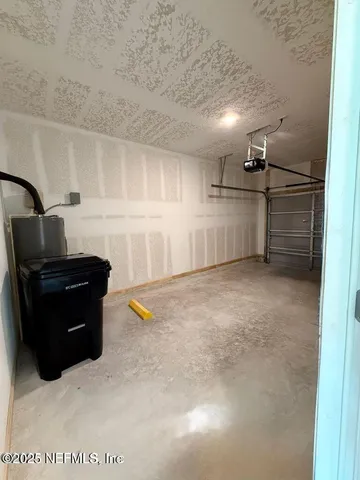 a kitchen with granite countertop cabinets and refrigerator