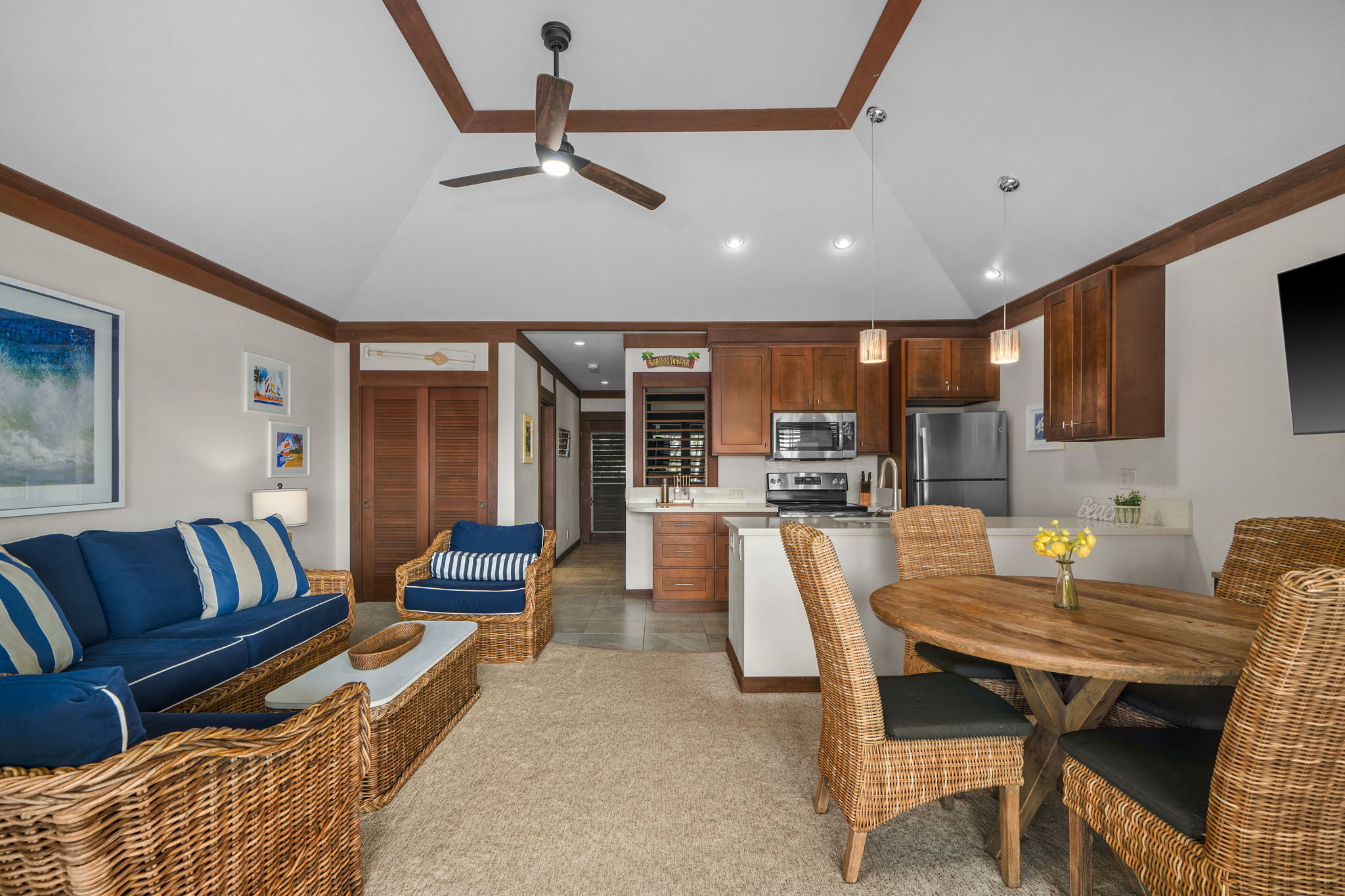 2253 Poipu Road, Unit 99 Koloa, HI 96756 - Photo 13 of 30 a living room with furniture and kitchen view