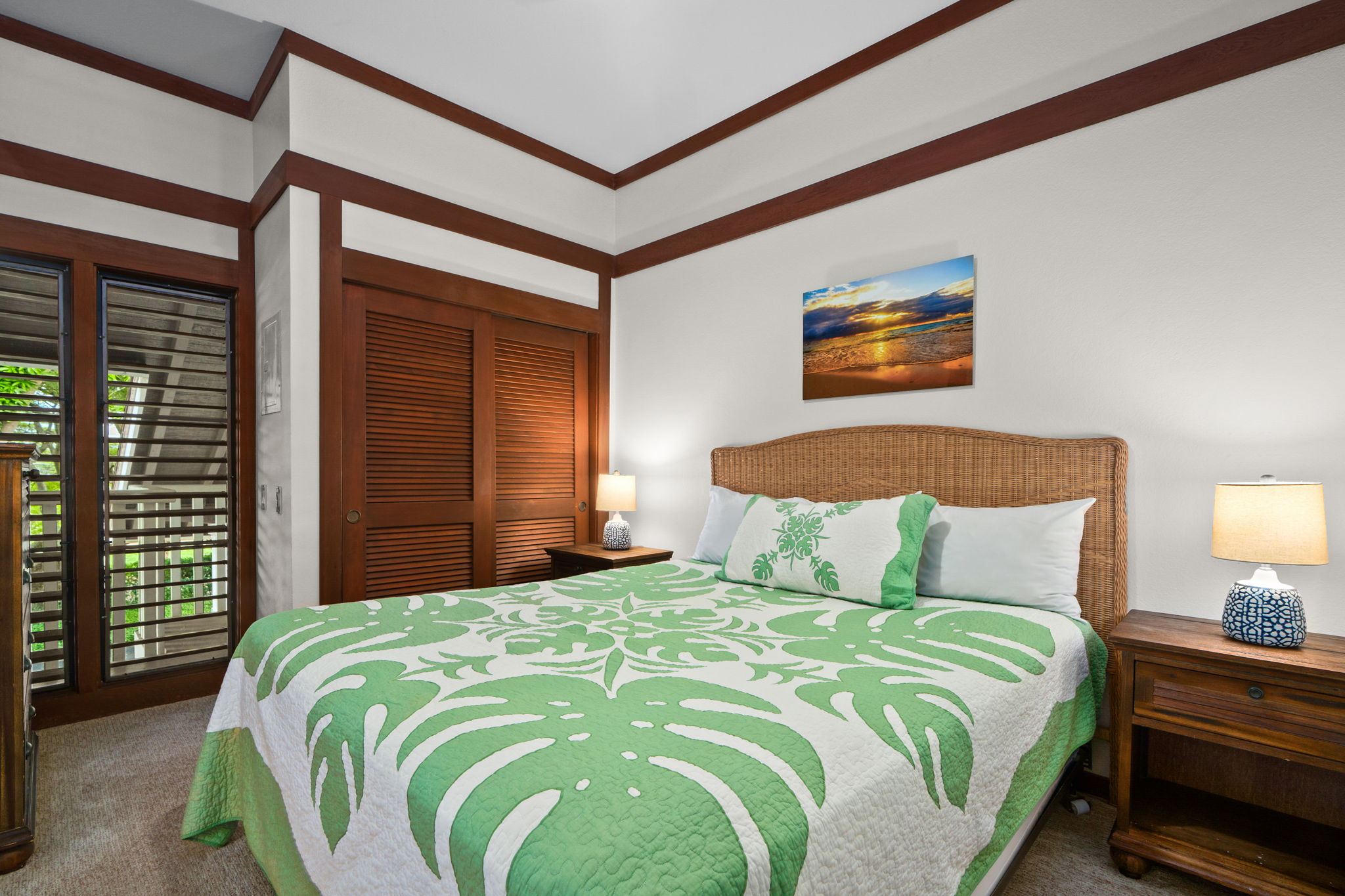 2253 Poipu Road, Unit 99 Koloa, HI 96756 - Photo 21 of 30 a bedroom with a bed and a painting on the wall