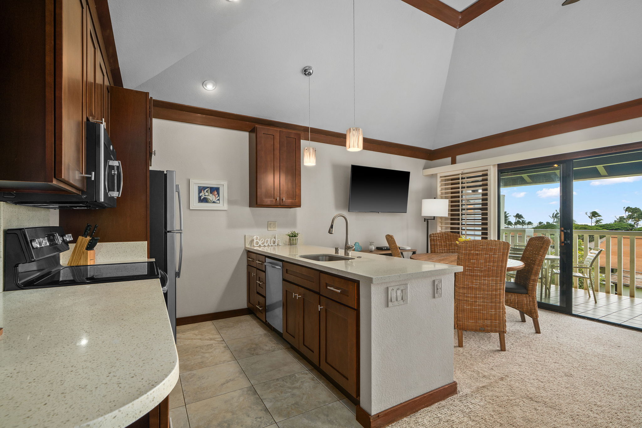 2253 Poipu Road, Unit 99 Koloa, HI 96756 - Photo 8 of 30 a kitchen with a stove and a refrigerator