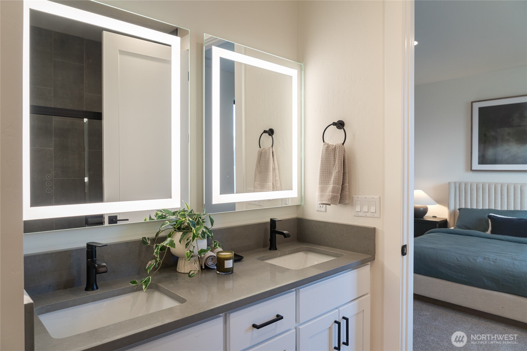 581 South Oasis Loop East Wenatchee, WA 98802 - Photo 19 of 33 a bathroom with a sink a potted plant and a window