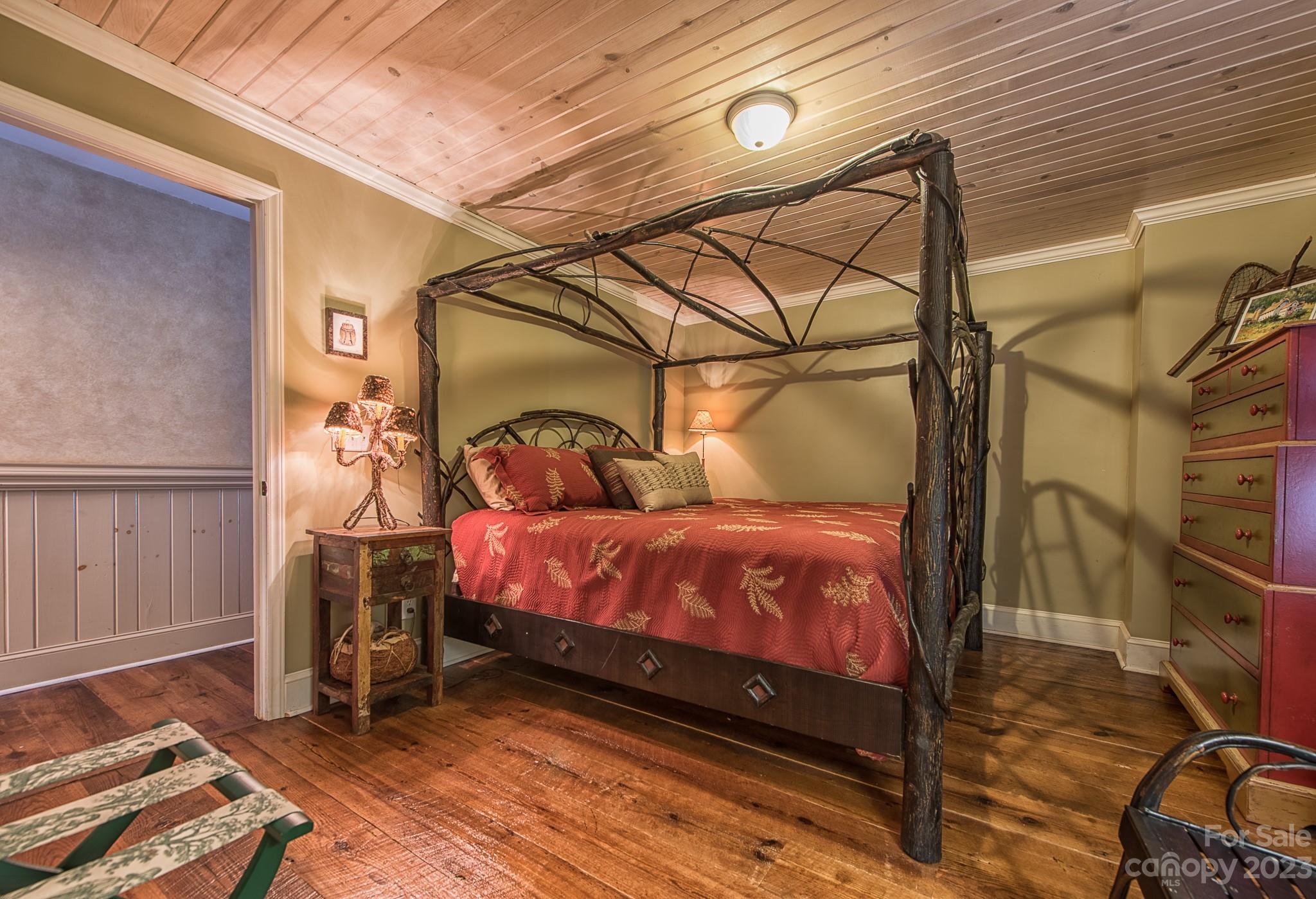 135 Winston Way Troutman, NC 28166 - Photo 17 of 48 a bed room with a bed and a mirror