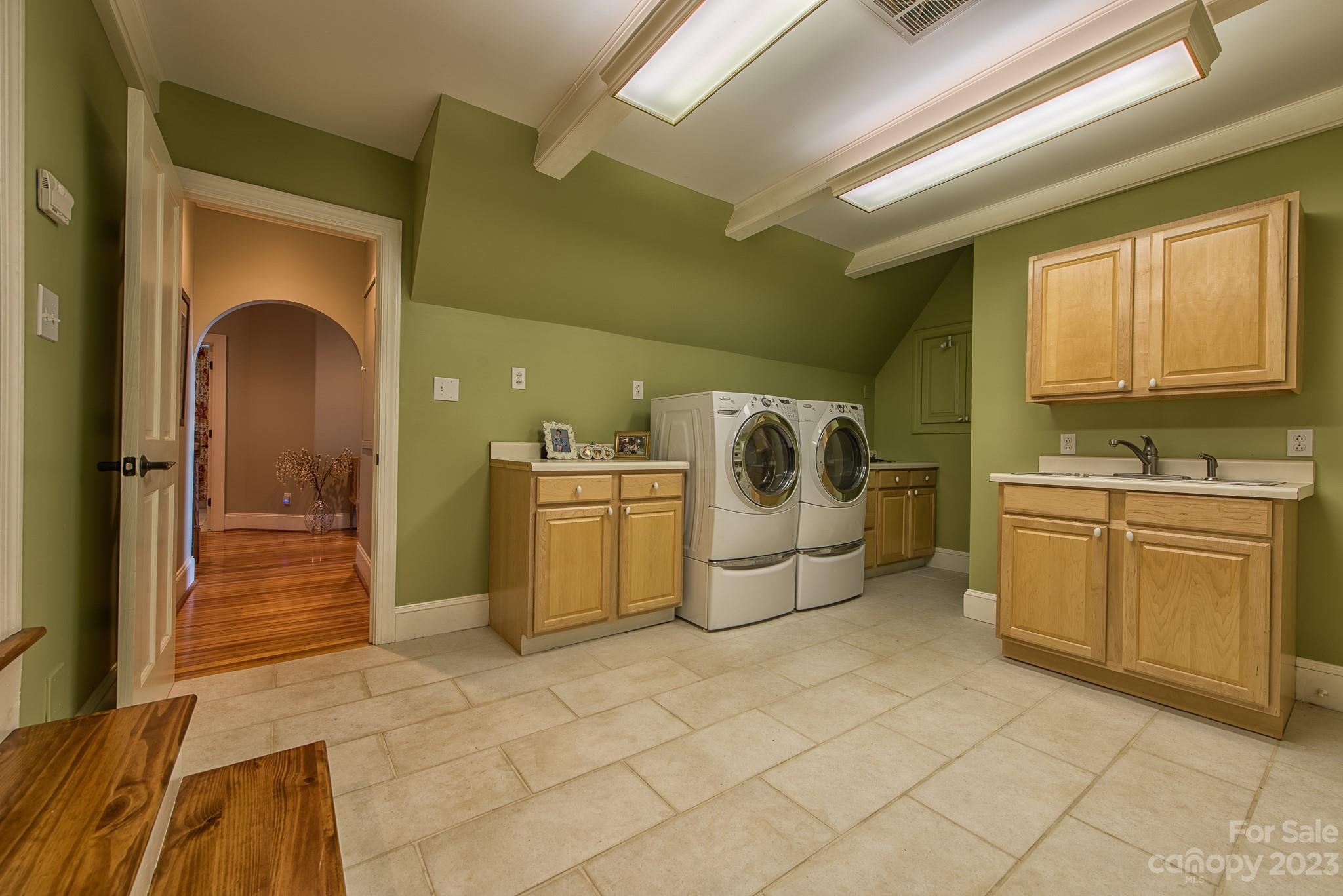 135 Winston Way Troutman, NC 28166 - Photo 34 of 48 a utility room with sink dryer and washer