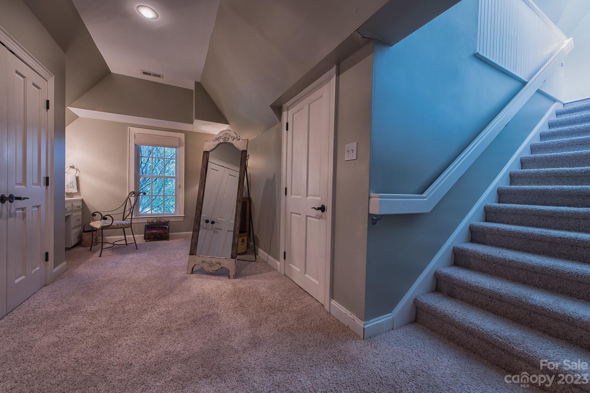 135 Winston Way Troutman, NC 28166 - Photo 39 of 48 a view of a hallway with entryway and stairs