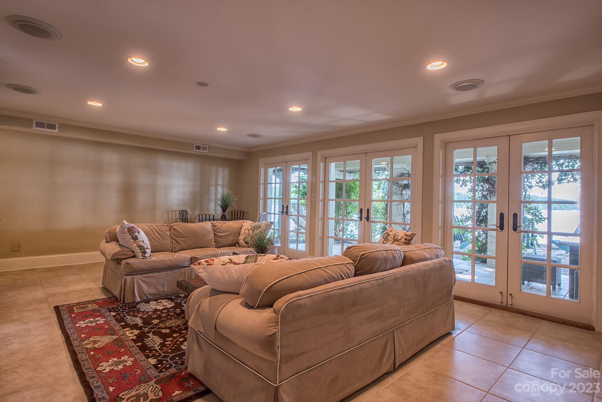 135 Winston Way Troutman, NC 28166 - Photo 42 of 48 a living room with furniture and large windows
