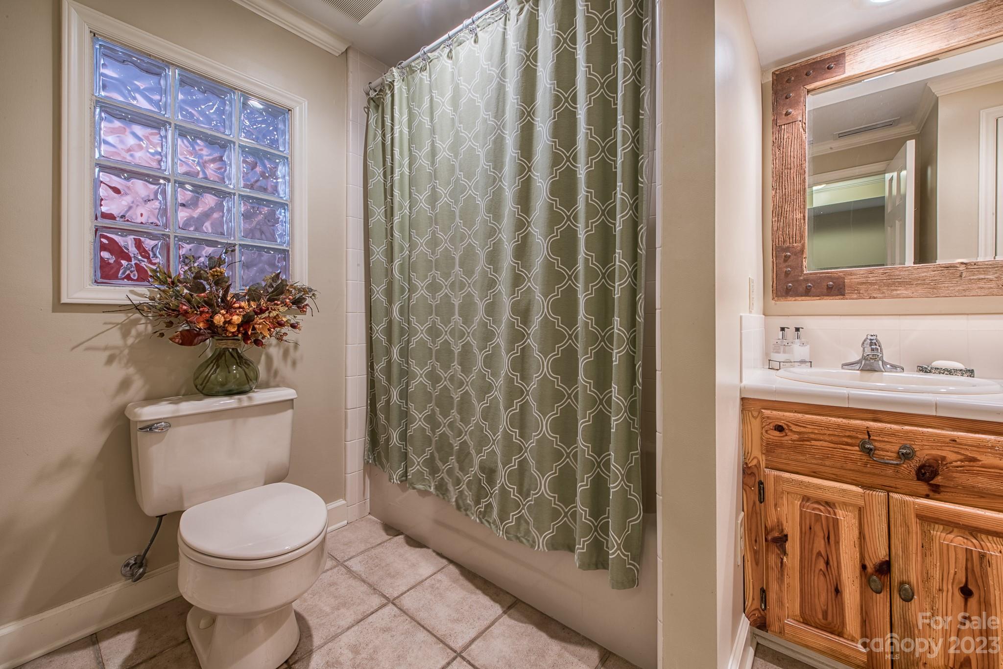 135 Winston Way Troutman, NC 28166 - Photo 44 of 48 a bathroom with a toilet a sink and a shower