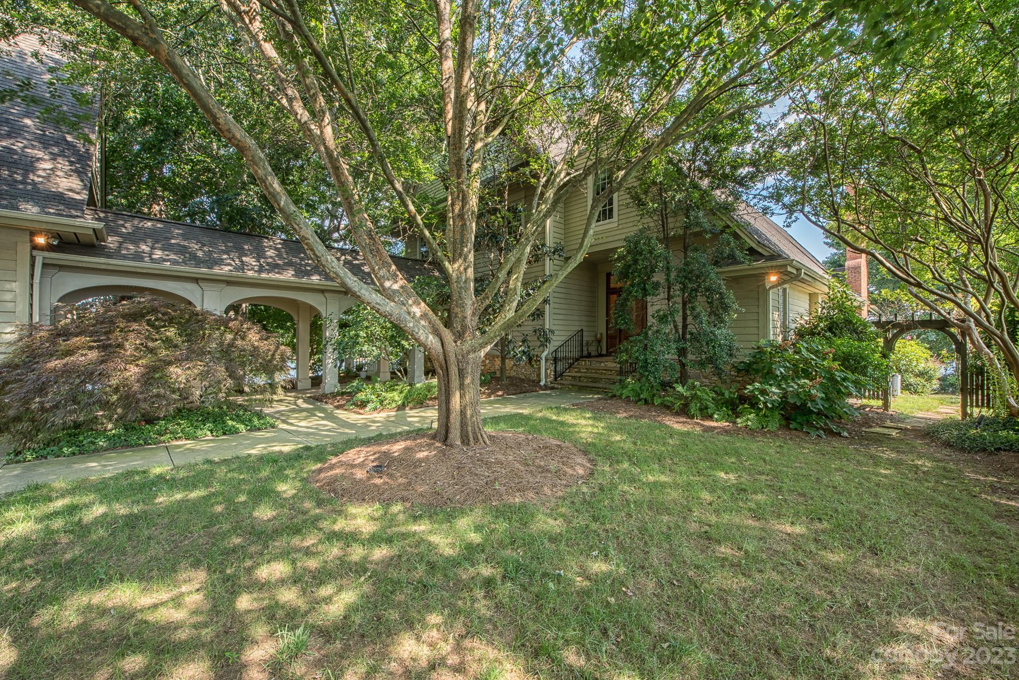 135 Winston Way Troutman, NC 28166 - Photo 8 of 48 a view of a tree in front of a house