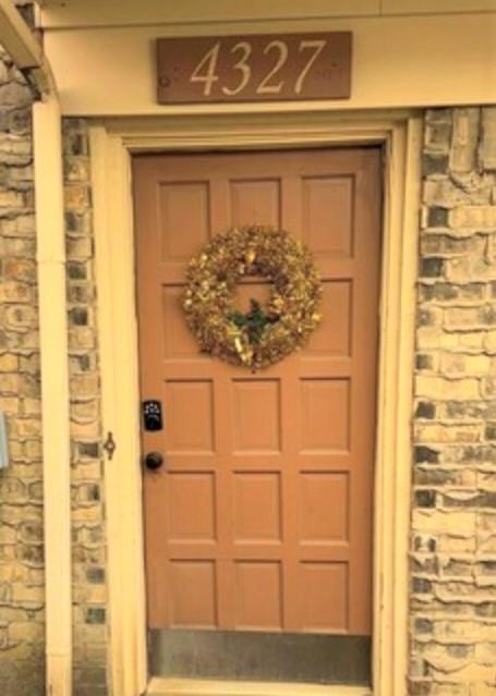 4327 Madera Road Irving, TX 75038 - Photo 1 of 1 a front door view with a wooden door