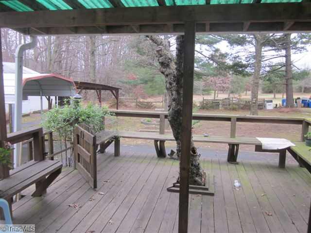 222 Wheeler Road Reidsville, NC 27320 - Photo 3 of 8 Patio/Deck. ENJOY SUMMER AFTERNOONS AND COOKOUTS ON THE BEAUTIFUL DECK OVERLOOKING QUIET BACK YARD.