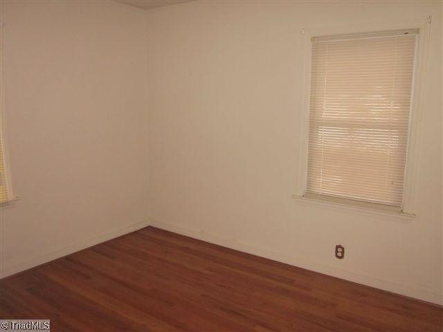 222 Wheeler Road Reidsville, NC 27320 - Photo 8 of 8 2nd Bedroom. BEDROOM WITH HWD FLOORS per seller hardwood under carpets except for the family room