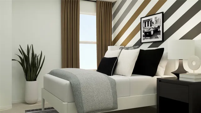 a bedroom with bed and window