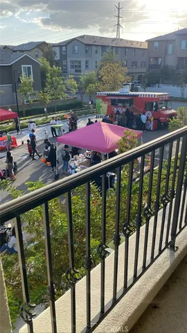 a view of a balcony with an outdoor seating