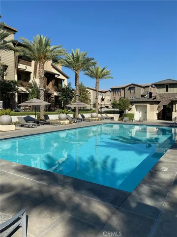 a view of a house with backyard porch and sitting area