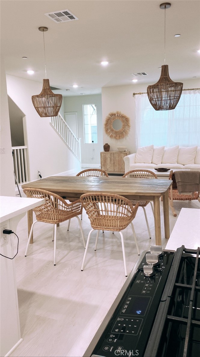 12228 Veranda Drive Rancho Cucamonga, CA 91739 - Photo 6 of 23 a kitchen with a table and chairs