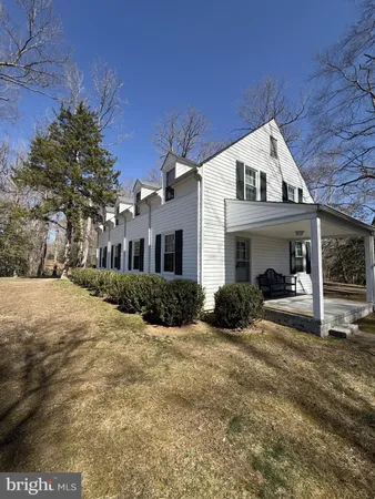 a view of house and yard