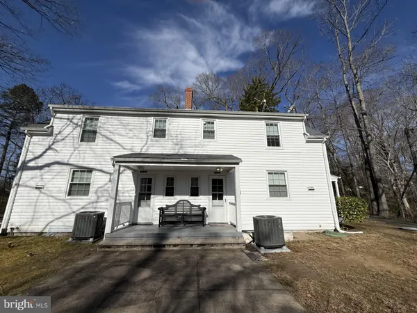 a view of house with yard