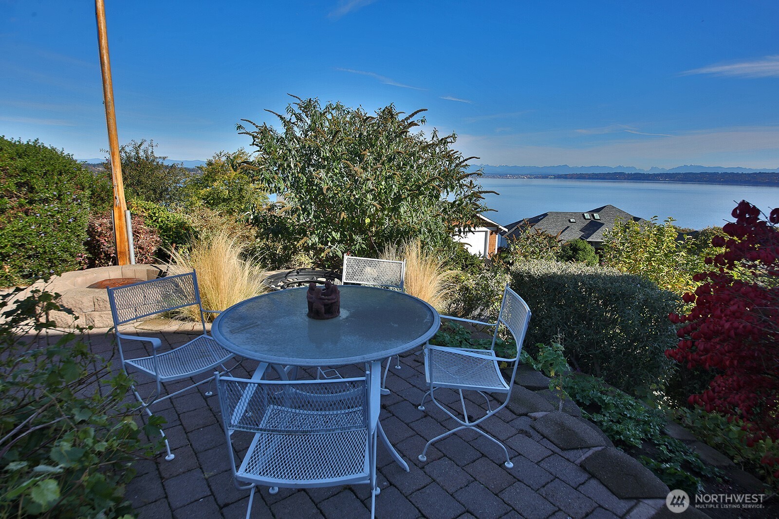 4694 Wrightsman Place Clinton, WA 98236 - Photo 36 of 38 a backyard of a house with table and chairs