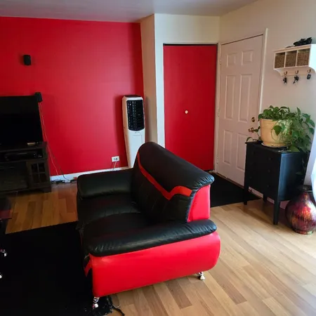 a bedroom with a bed and closet