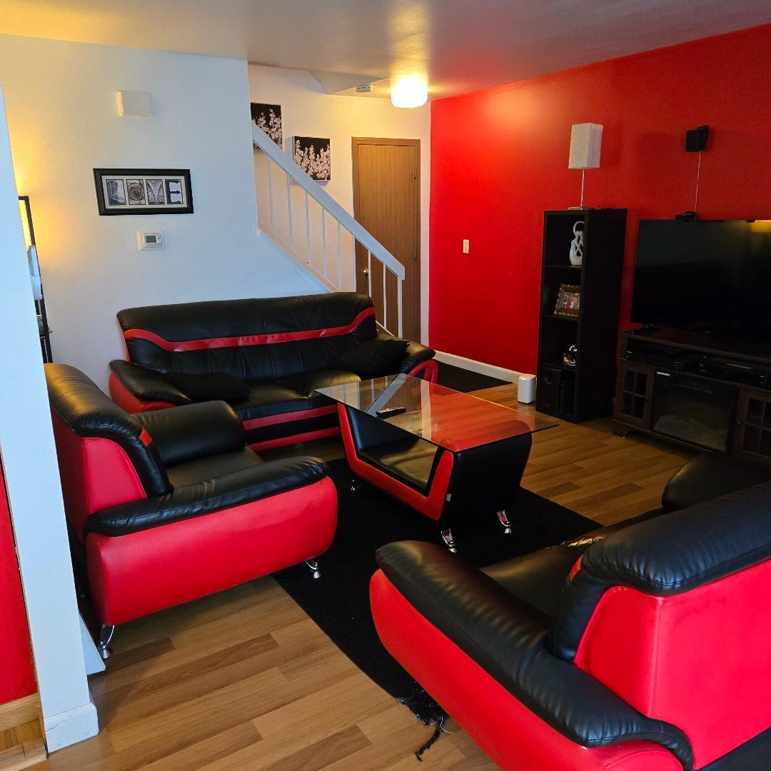 228 Elkhorn Court, Unit B Bolingbrook, IL 60440 - Photo 13 of 15 a living room with furniture and a flat screen tv