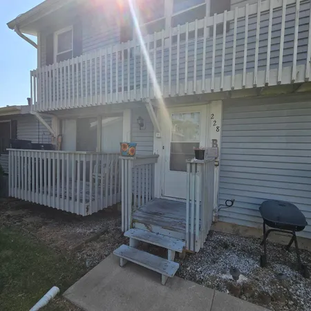 a view of a porch with a bench