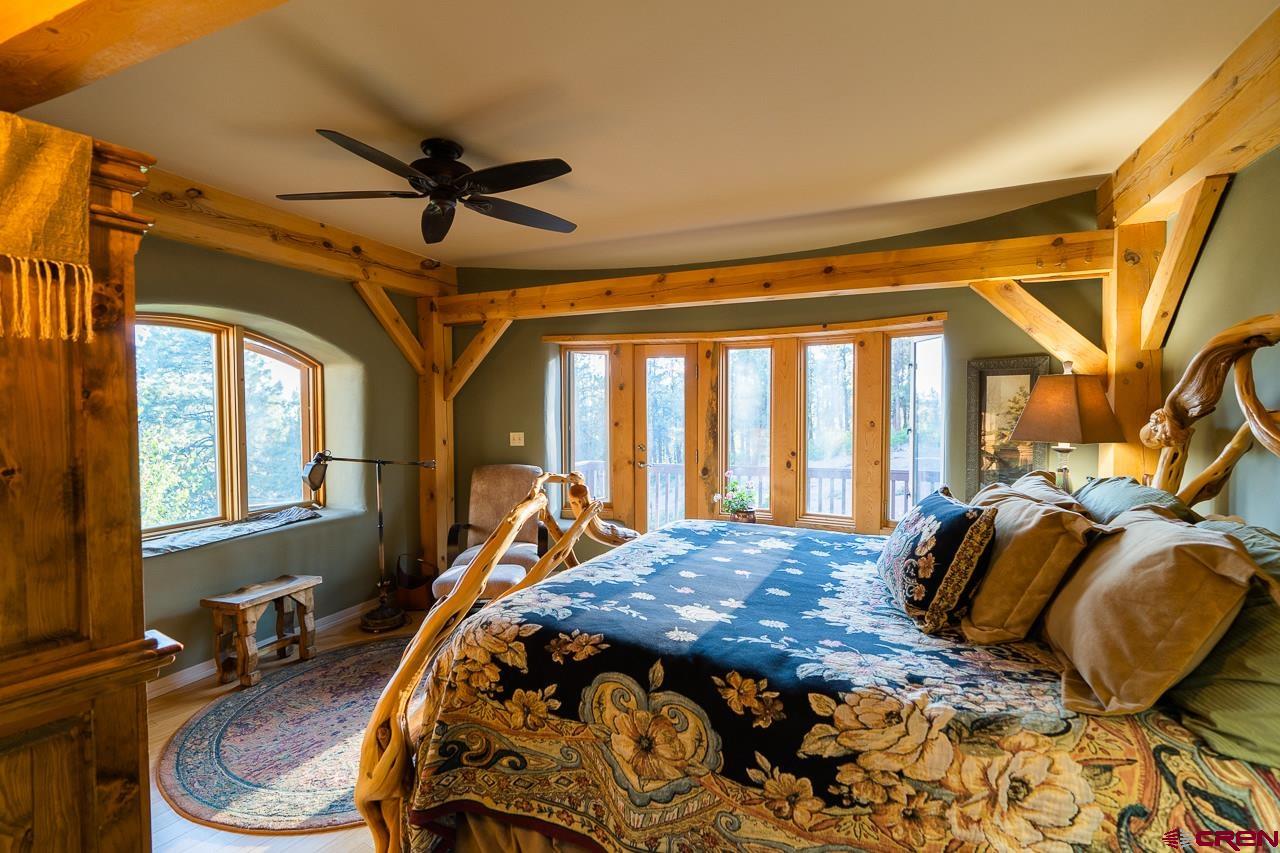 200 Longview Lane Bayfield, CO 81122 - Photo 12 of 33 a bed sitting in a bedroom next to a window